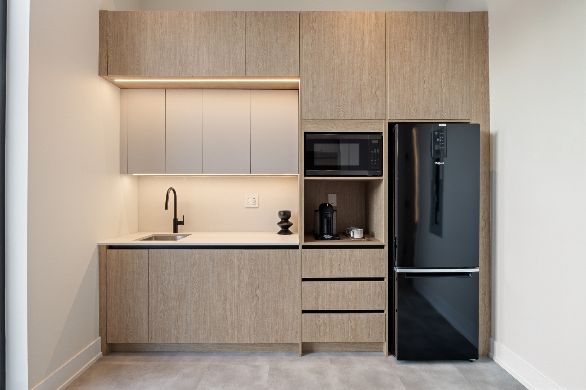 Completed staff amenity area with integrated cabinetry